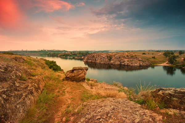 Artem Nosenko: rocks stones river water grass city sky 